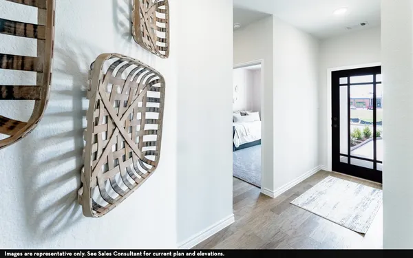 wooden floor with windows and entrance