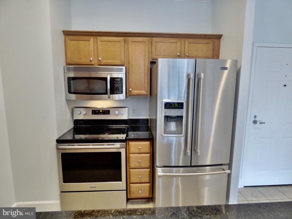 11800 Sunset Hills Road, Unit 118 Reston, VA 20190 - Photo 12 of 52 Sleek kitchen with modern appliances.