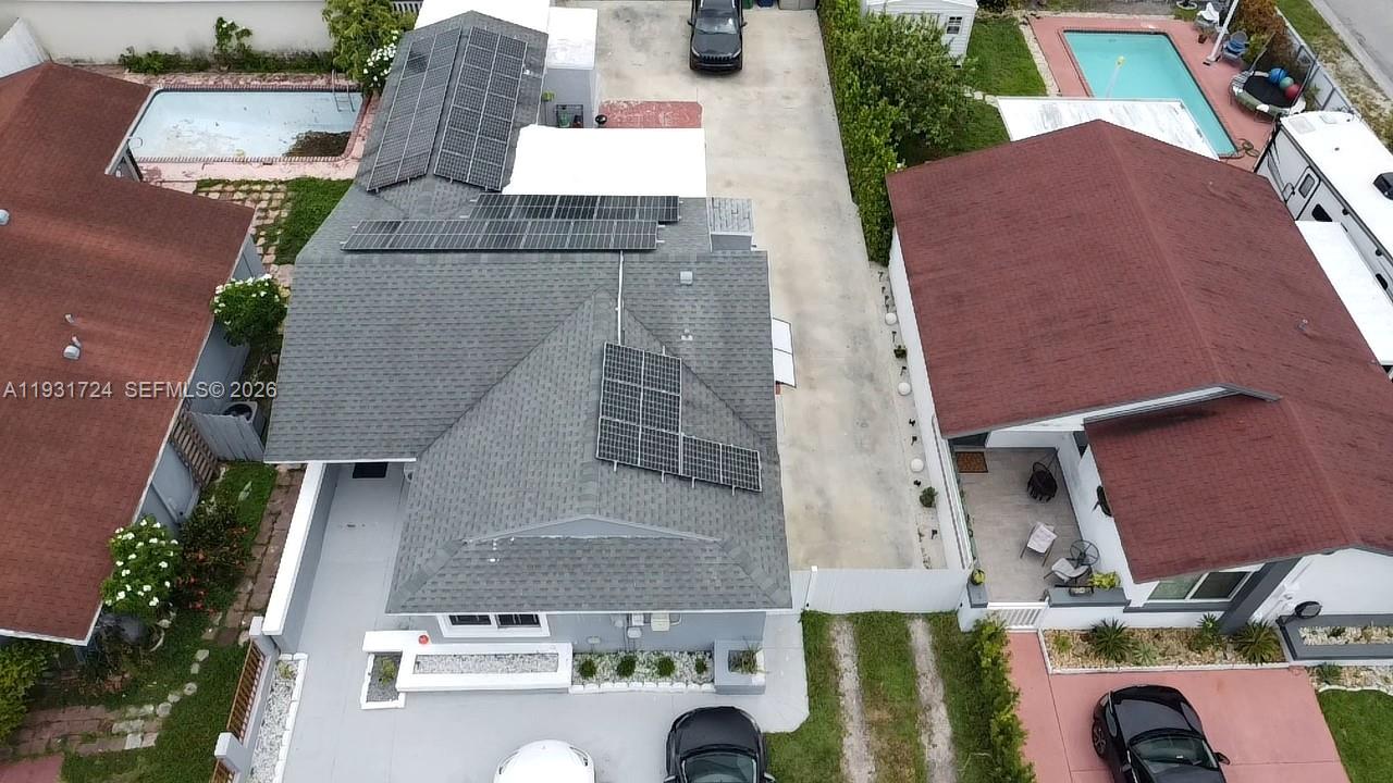 12374 Southwest 197th Terrace Miami, FL 33177 - Photo 2 of 18 an aerial view of residential houses with outdoor space