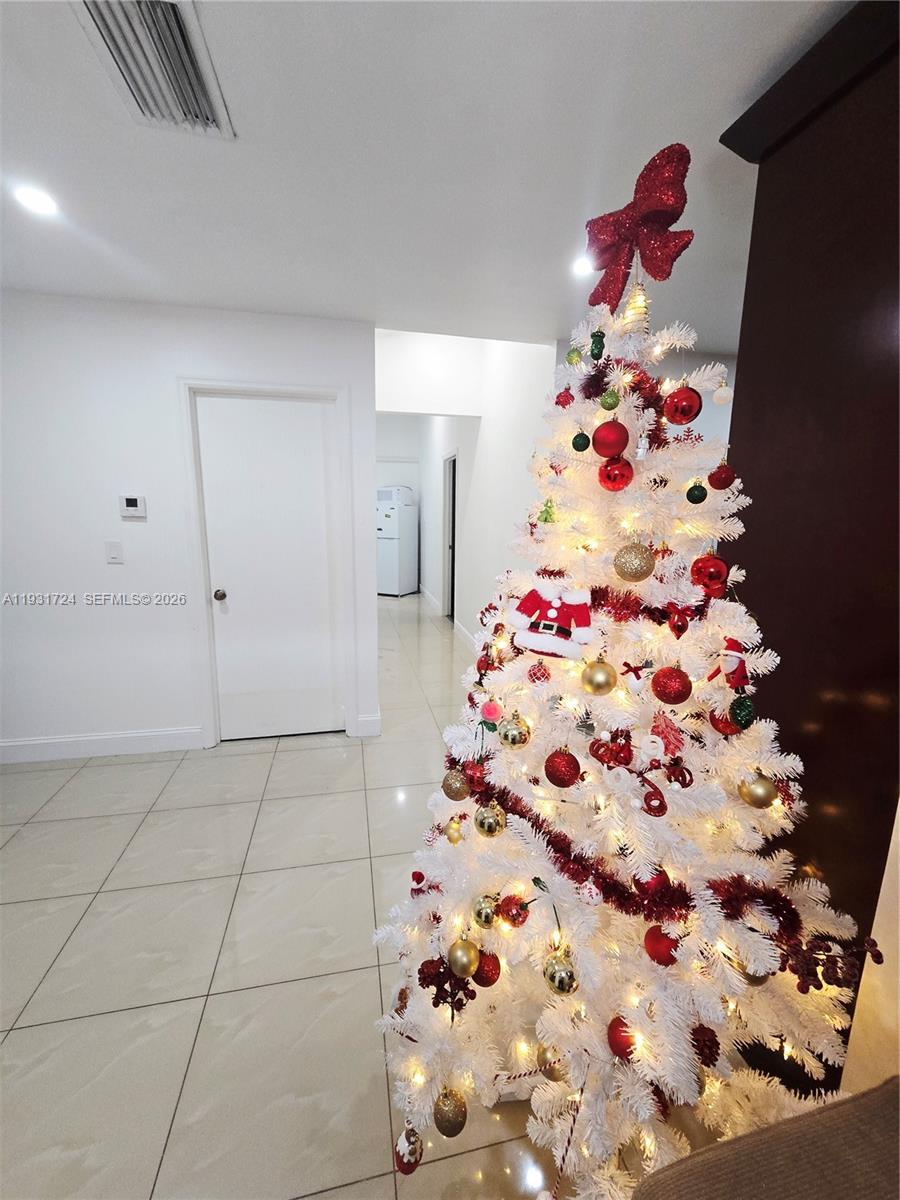 12374 Southwest 197th Terrace Miami, FL 33177 - Photo 3 of 18 a vase of flowers sitting on a floor