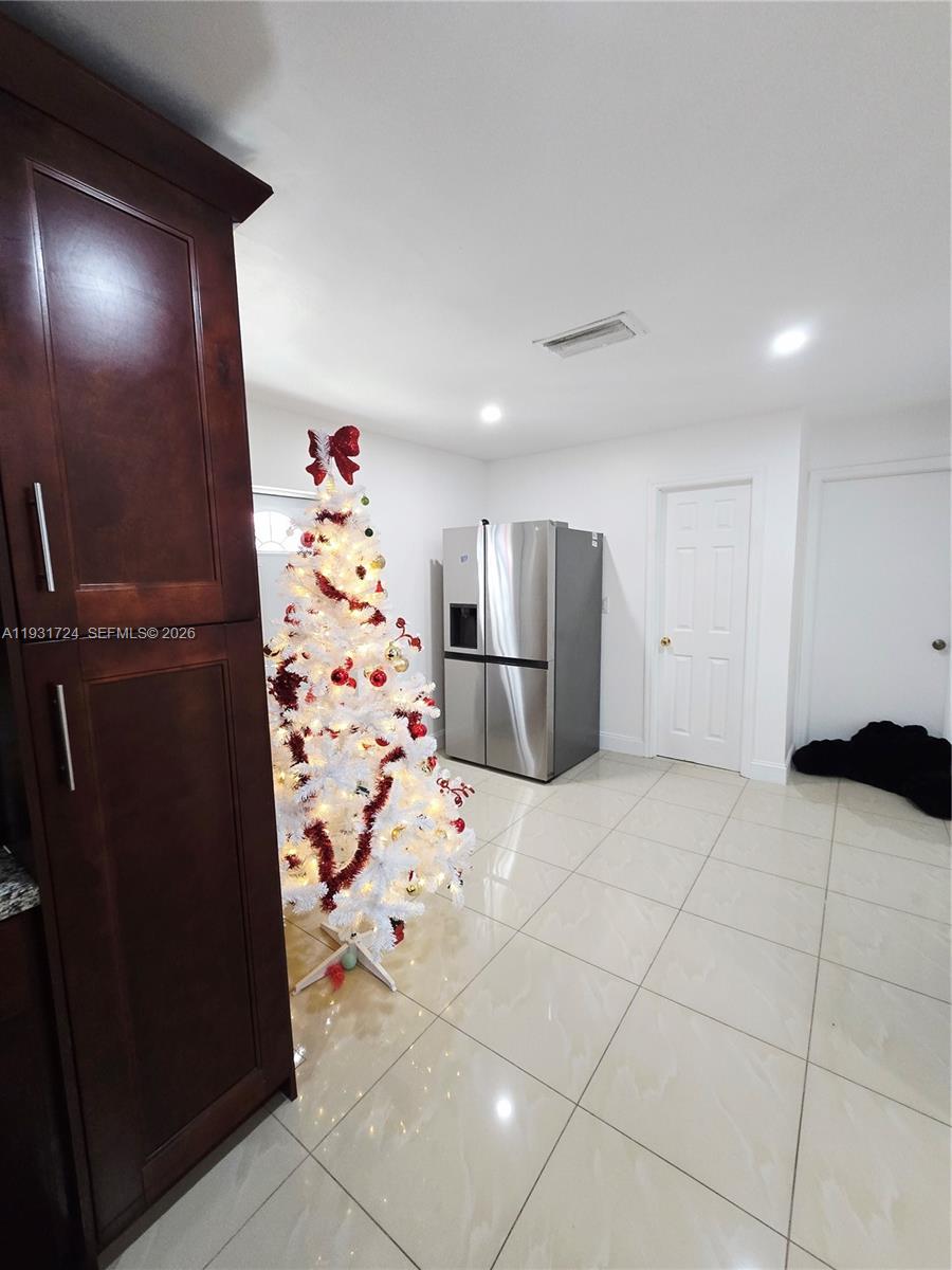 12374 Southwest 197th Terrace Miami, FL 33177 - Photo 4 of 18 a view of kitchen with refrigerator and furniture
