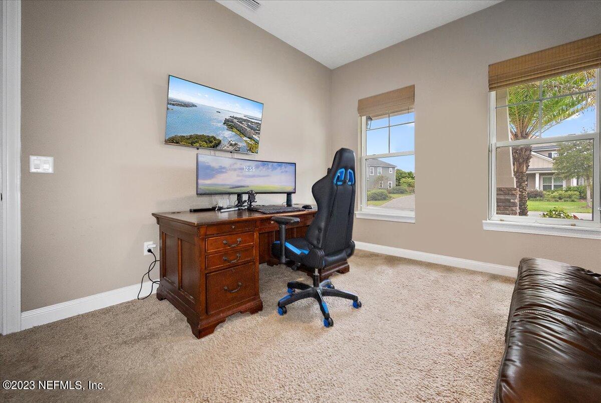 39 Seahill Drive St. Augustine, FL 32092 - Photo 15 of 37 a view of a workspace with furniture and a window