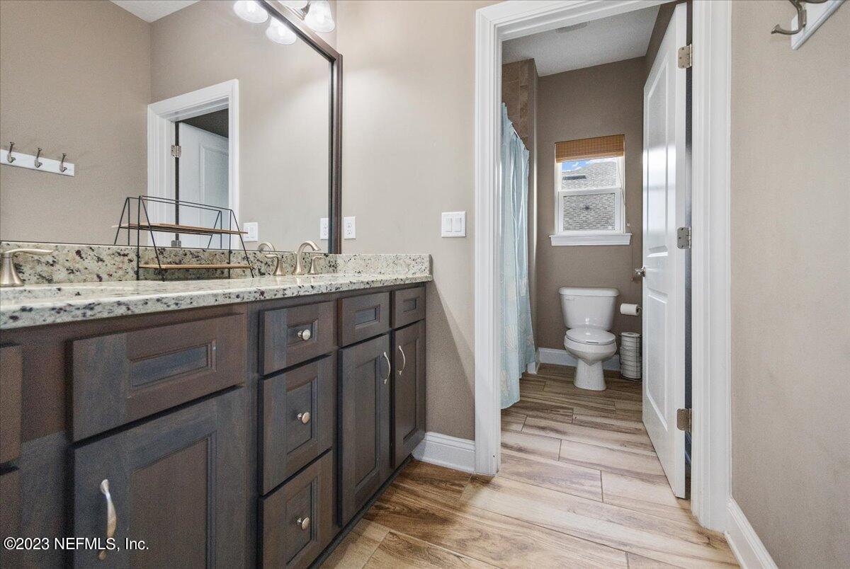 39 Seahill Drive St. Augustine, FL 32092 - Photo 21 of 37 a spacious bathroom with a toilet sink and a mirror