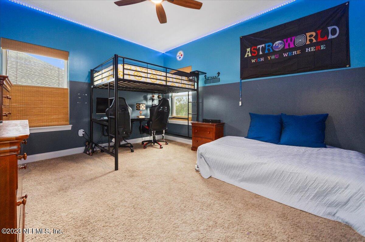 39 Seahill Drive St. Augustine, FL 32092 - Photo 22 of 37 a bedroom with furniture and a air conditioner vent