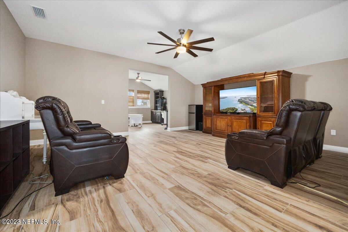 39 Seahill Drive St. Augustine, FL 32092 - Photo 23 of 37 a living room with furniture and a wooden floor