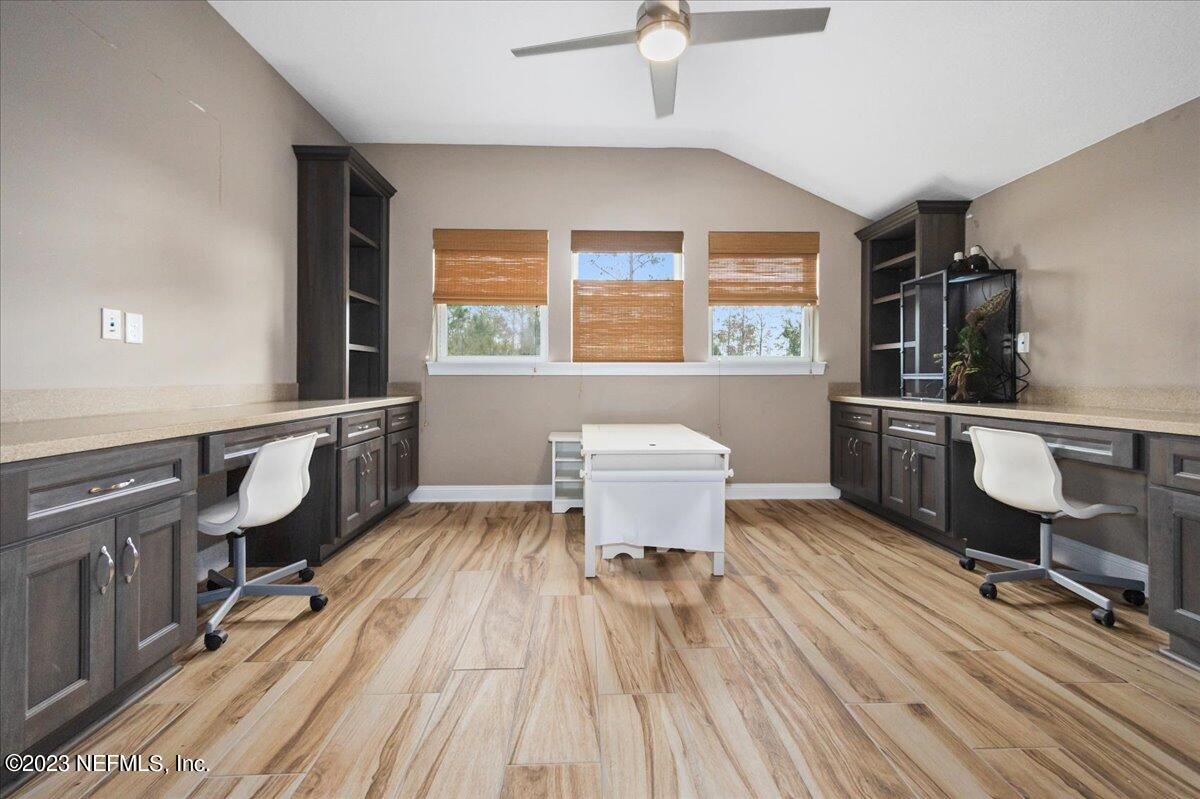 39 Seahill Drive St. Augustine, FL 32092 - Photo 24 of 37 a room with wooden floor and furniture