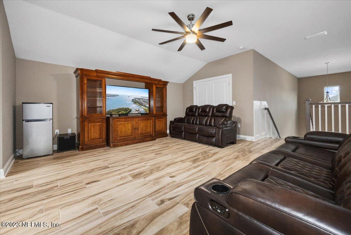 39 Seahill Drive St. Augustine, FL 32092 - Photo 25 of 37 a bedroom with a bed and wooden floor