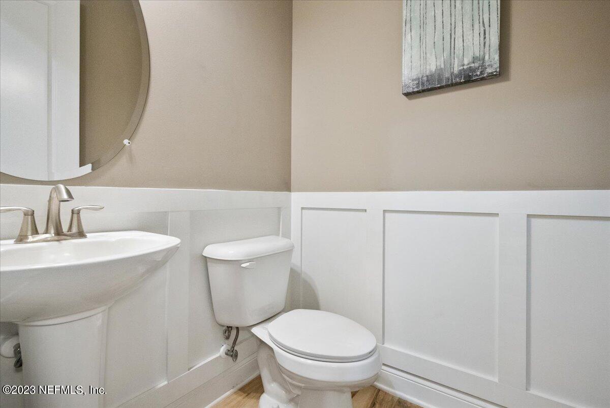 39 Seahill Drive St. Augustine, FL 32092 - Photo 26 of 37 a bathroom with a toilet a sink and mirror