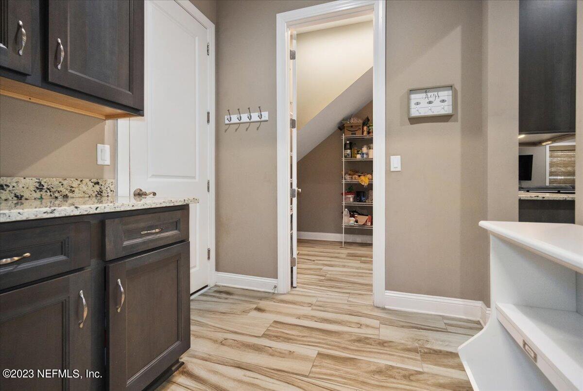 39 Seahill Drive St. Augustine, FL 32092 - Photo 28 of 37 a view of a kitchen cabinets and wooden floor