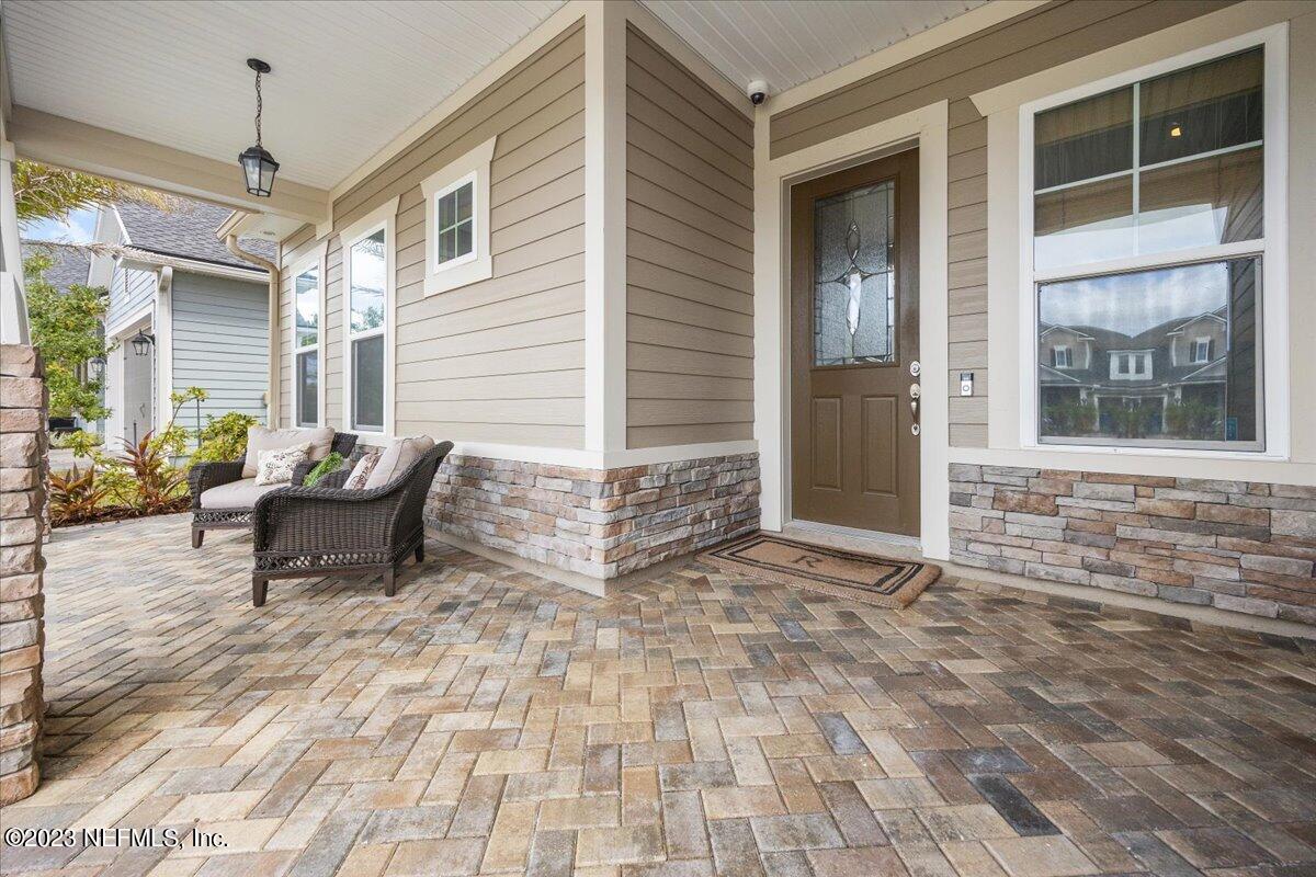 39 Seahill Drive St. Augustine, FL 32092 - Photo 3 of 37 a view of a lounge chair in the porch