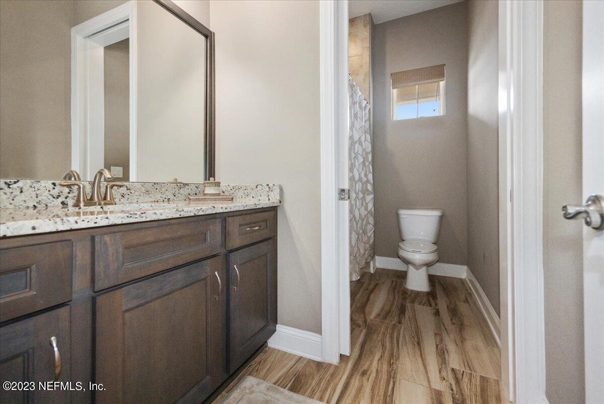 39 Seahill Drive St. Augustine, FL 32092 - Photo 6 of 37 a bathroom with a sink a toilet and a mirror