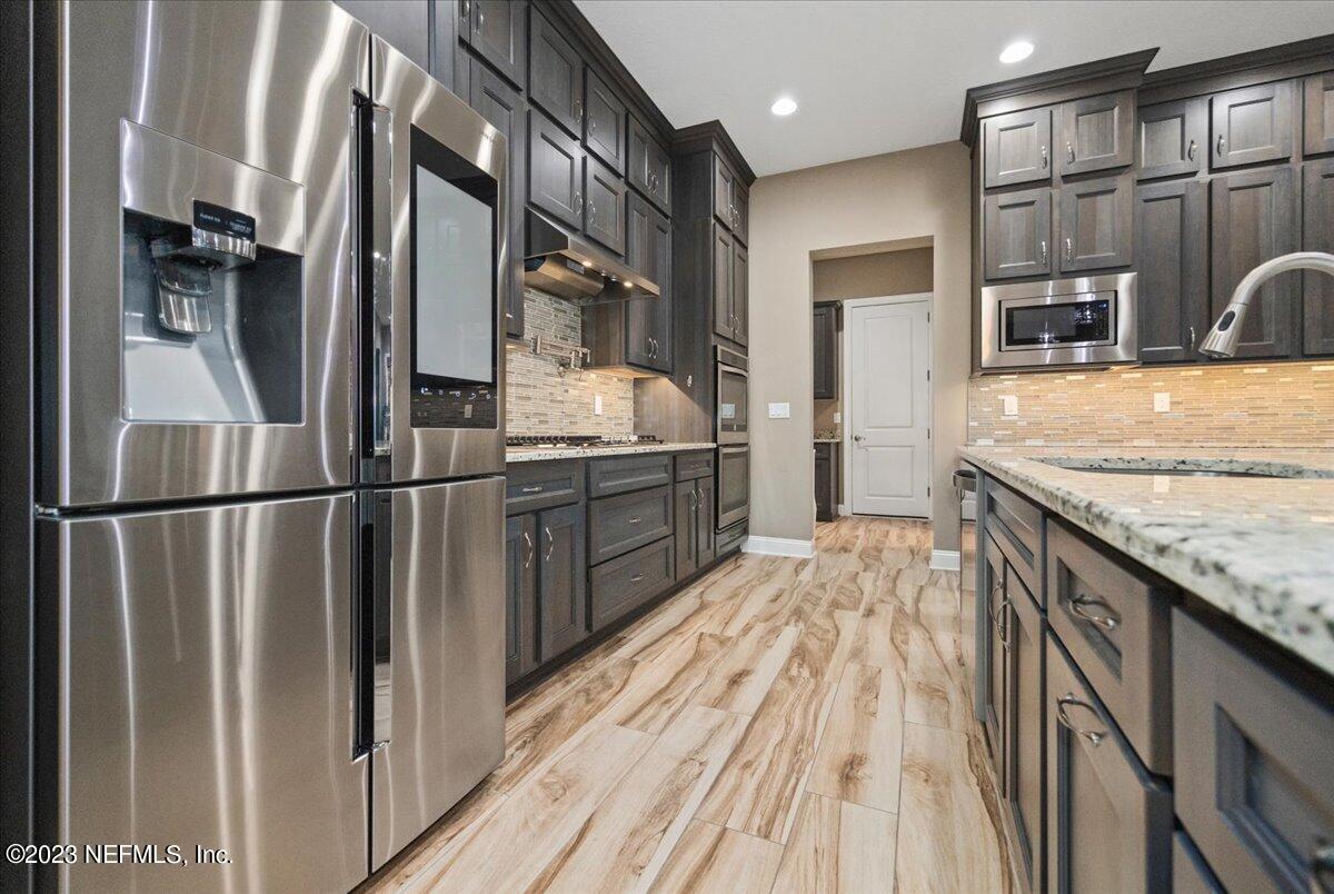 39 Seahill Drive St. Augustine, FL 32092 - Photo 7 of 37 a kitchen with stainless steel appliances granite countertop a refrigerator and a sink