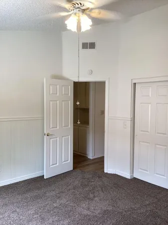a kitchen with a stove a sink a microwave a refrigerator and cabinets