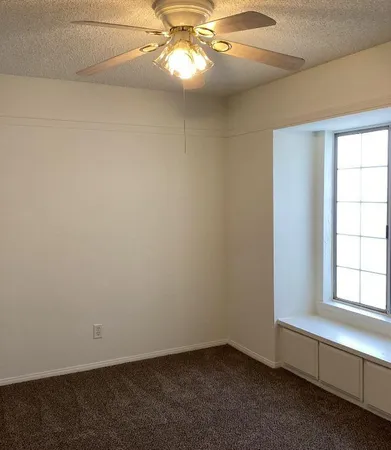a bedroom with bed and window