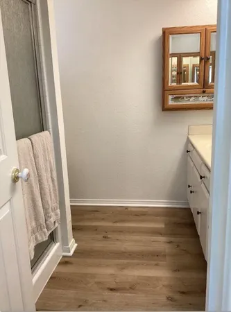 a view of washer and dryer with kitchen in the background