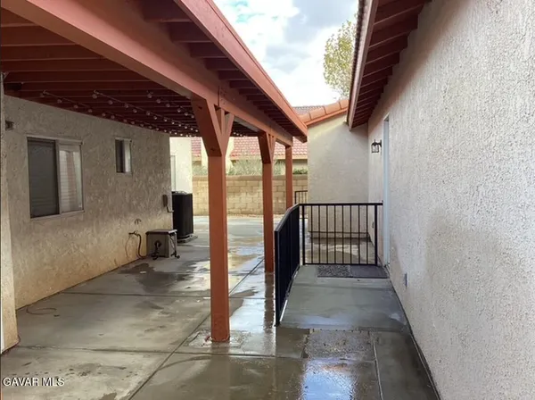a bathroom with a toilet and a shower curtain