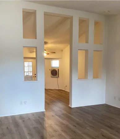 a kitchen with a refrigerator and a stove