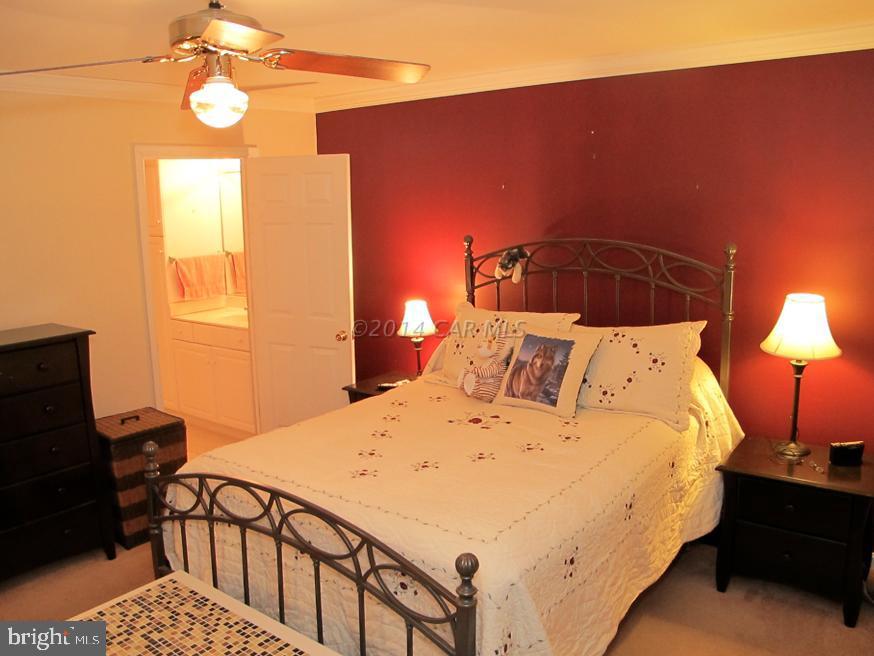 35 Falcon Bridge Road Berlin, MD 21811 - Photo 12 of 21 a bedroom with bed and window