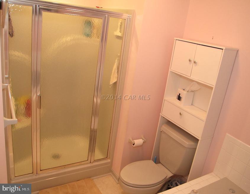 35 Falcon Bridge Road Berlin, MD 21811 - Photo 15 of 21 a white toilet sitting next to a shower