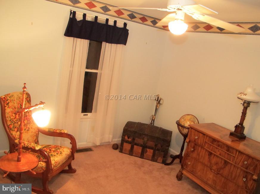 35 Falcon Bridge Road Berlin, MD 21811 - Photo 17 of 21 a bedroom with bed and wooden floor