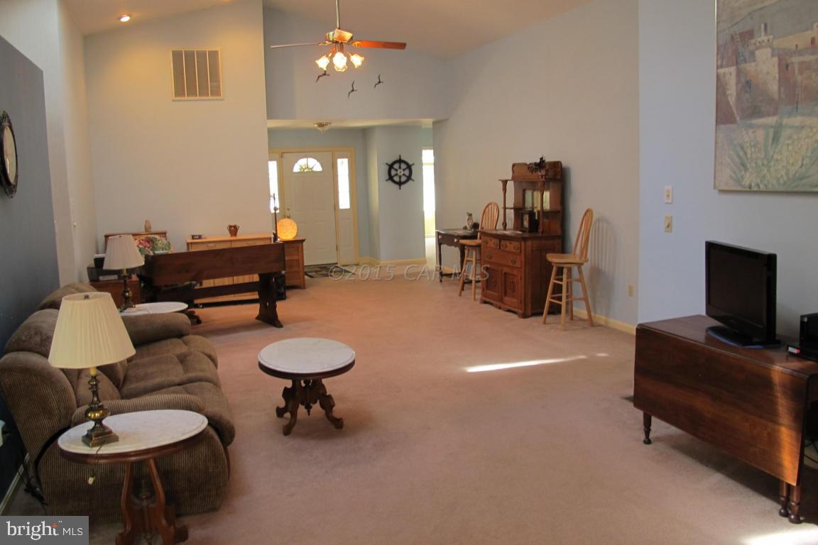 35 Falcon Bridge Road Berlin, MD 21811 - Photo 3 of 21 a living room with furniture and a chandelier