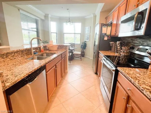 a kitchen with a sink stove and cabinets