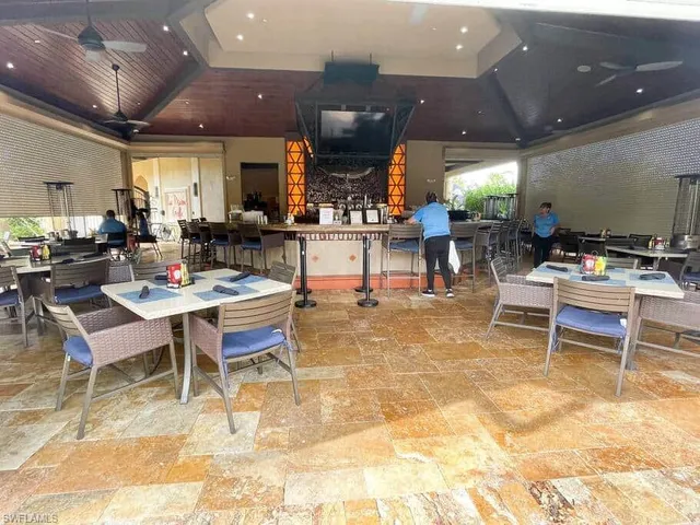 a living room with lots of furniture and a table