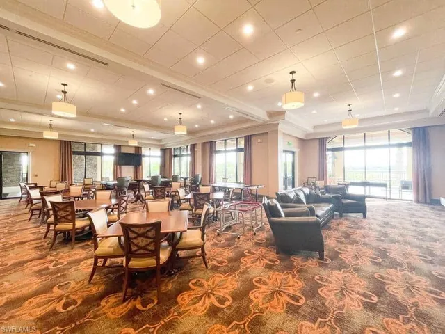 a large room with lots of furniture and chairs