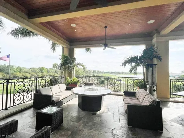 a view of a patio with couches chairs and a potted plants