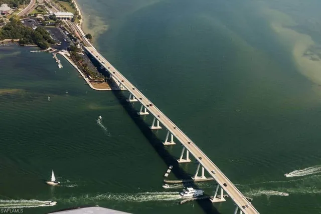 a view of a balcony with floor to ceiling windows