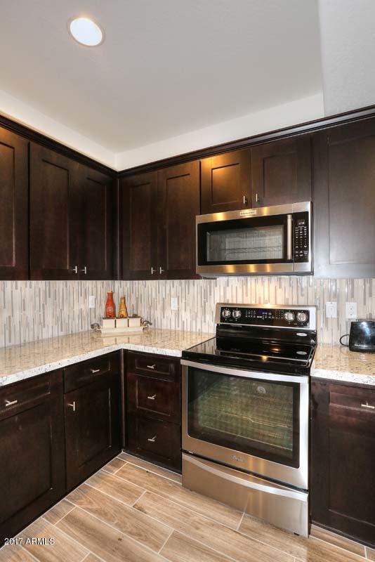 3935 East Rough Rider Road, Unit 1271 Phoenix, AZ 85050 - Photo 13 of 43 Kitchen-Range