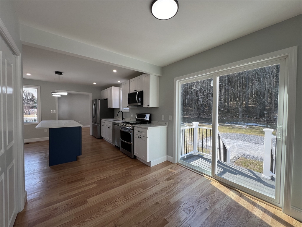 136 Old Bolton Road Stow, MA 01775 - Photo 11 of 34 a view of kitchen with sink and wooden floor