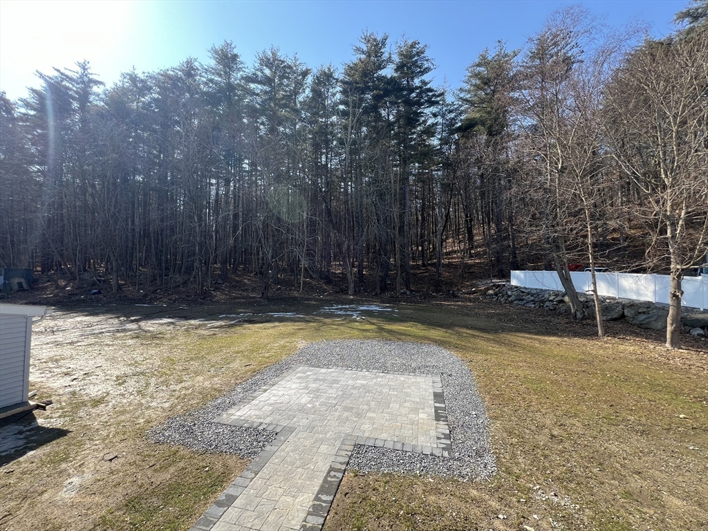 136 Old Bolton Road Stow, MA 01775 - Photo 28 of 34 a view of swimming pool with trees in the background