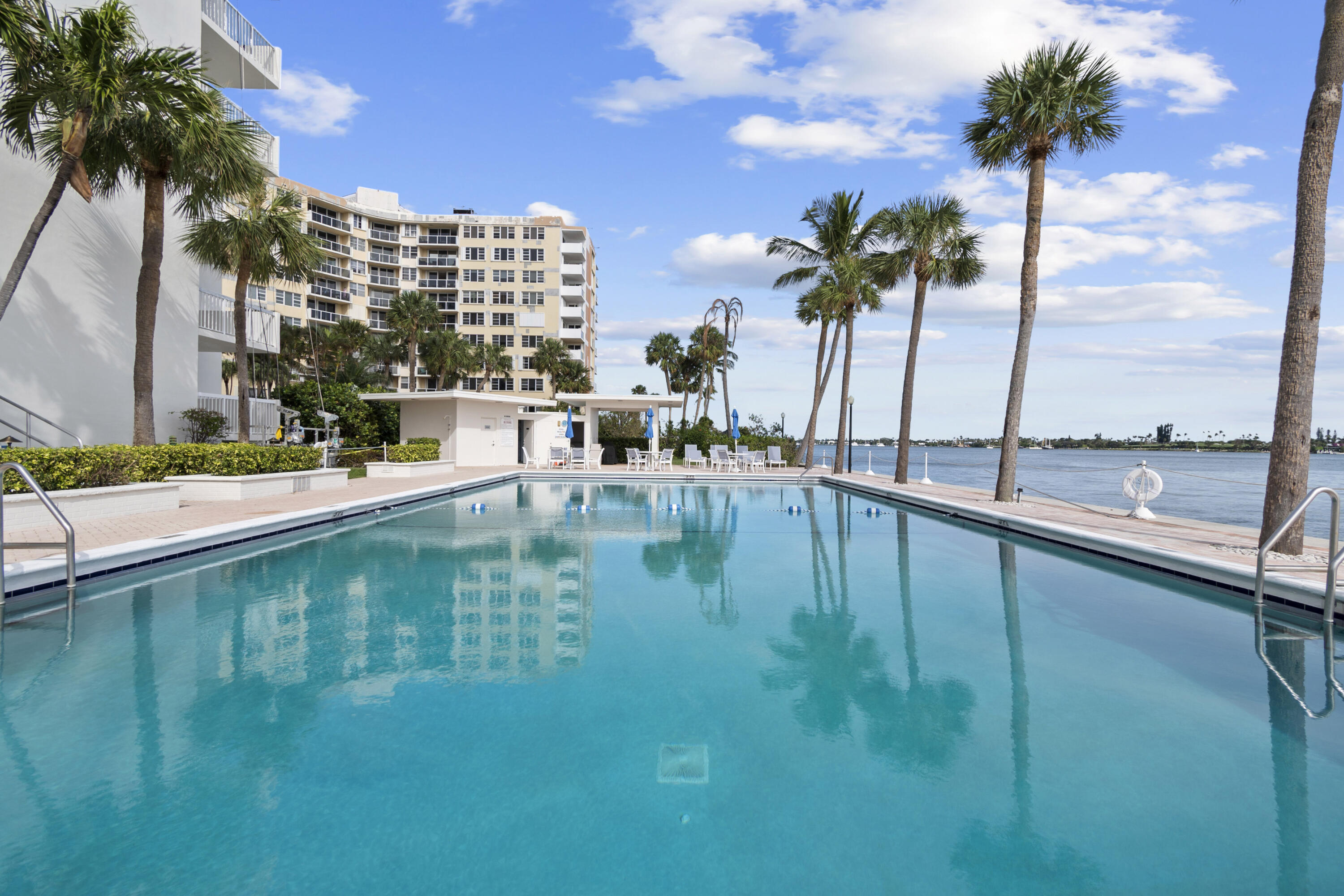 2600 North Flagler Drive, Unit 1007 West Palm Beach, FL 33407 - Photo 19 of 26 a view of swimming pool with outdoor seating and lake view