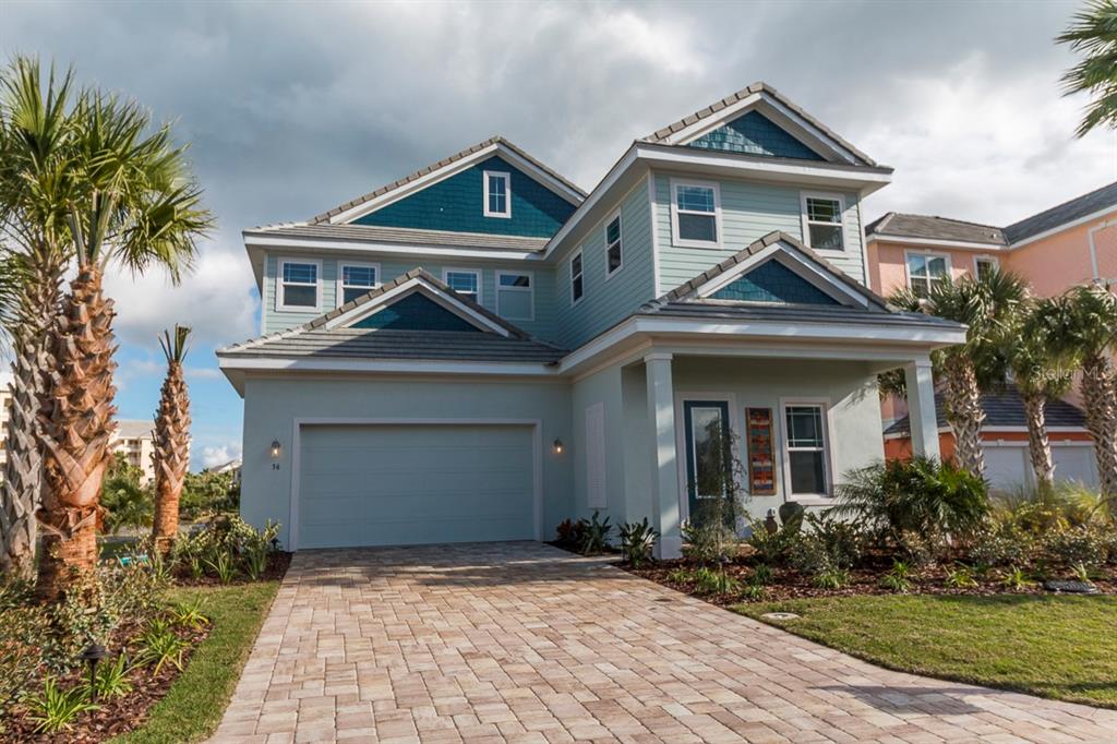 36 Cinnamon Beach Way Palm Coast, FL 32137 - Photo 1 of 1 a front view of a house with a yard and garage