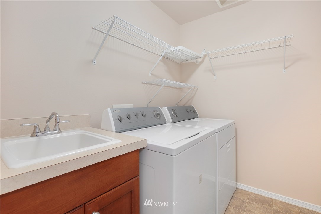 3918 Northeast 4th Circle Renton, WA 98056 - Photo 22 of 25 a utility room with dryer and washer