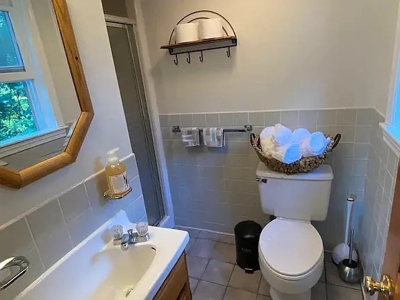1296 Drift Road, Unit B Westport, MA 02790 - Photo 6 of 12 a bathroom with a sink mirror and toilet