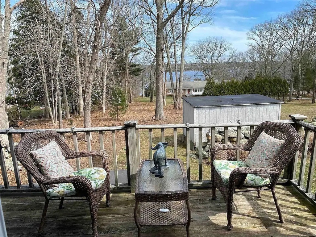 1296 Drift Road, Unit B Westport, MA 02790 - Photo 7 of 12 a view of balcony with couch and chairs