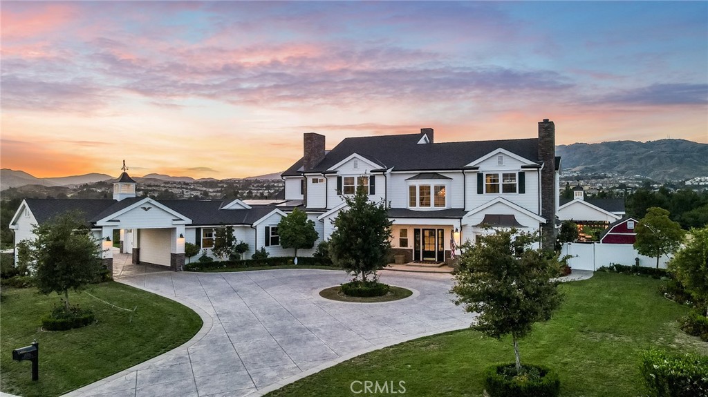 20231 Monteria Park Road Chatsworth, CA 91311 - Photo 1 of 1 a front view of a house with yard and green space