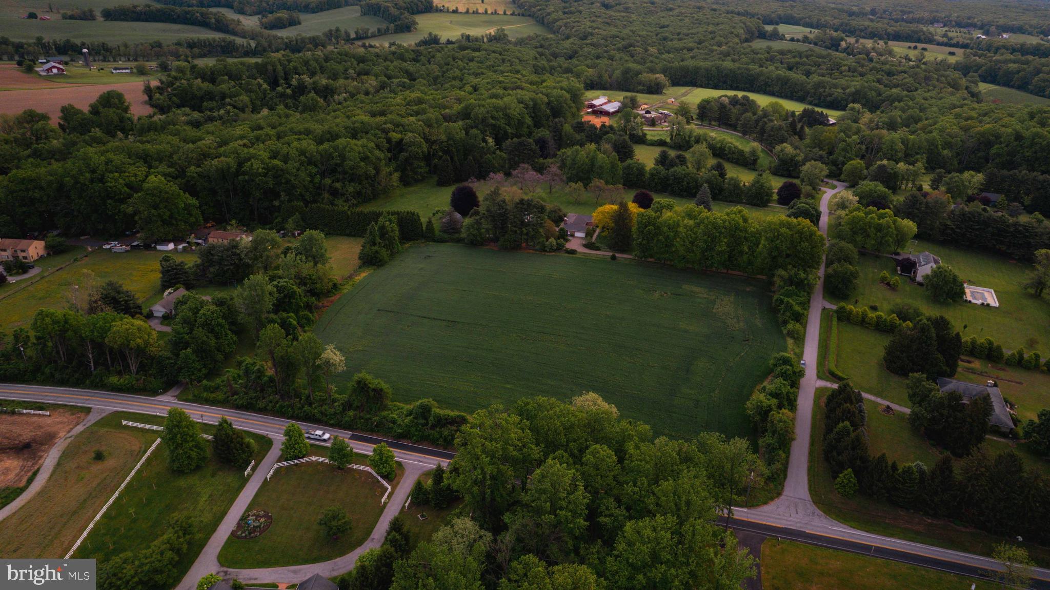 an aerial view of a house having yard
