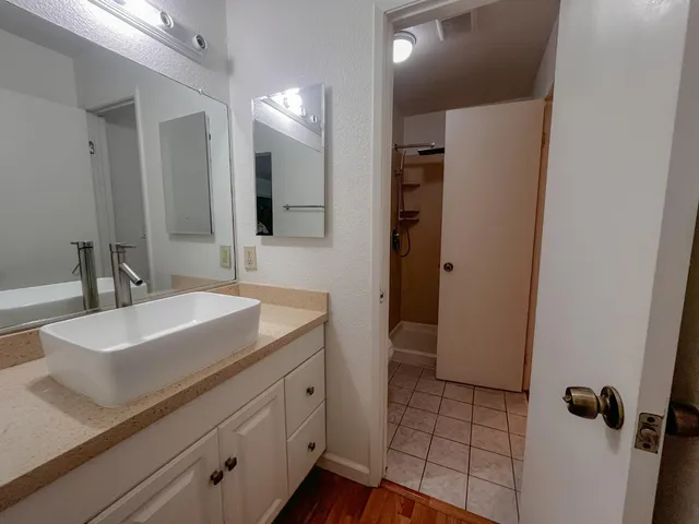 a bathroom with a sink and a mirror