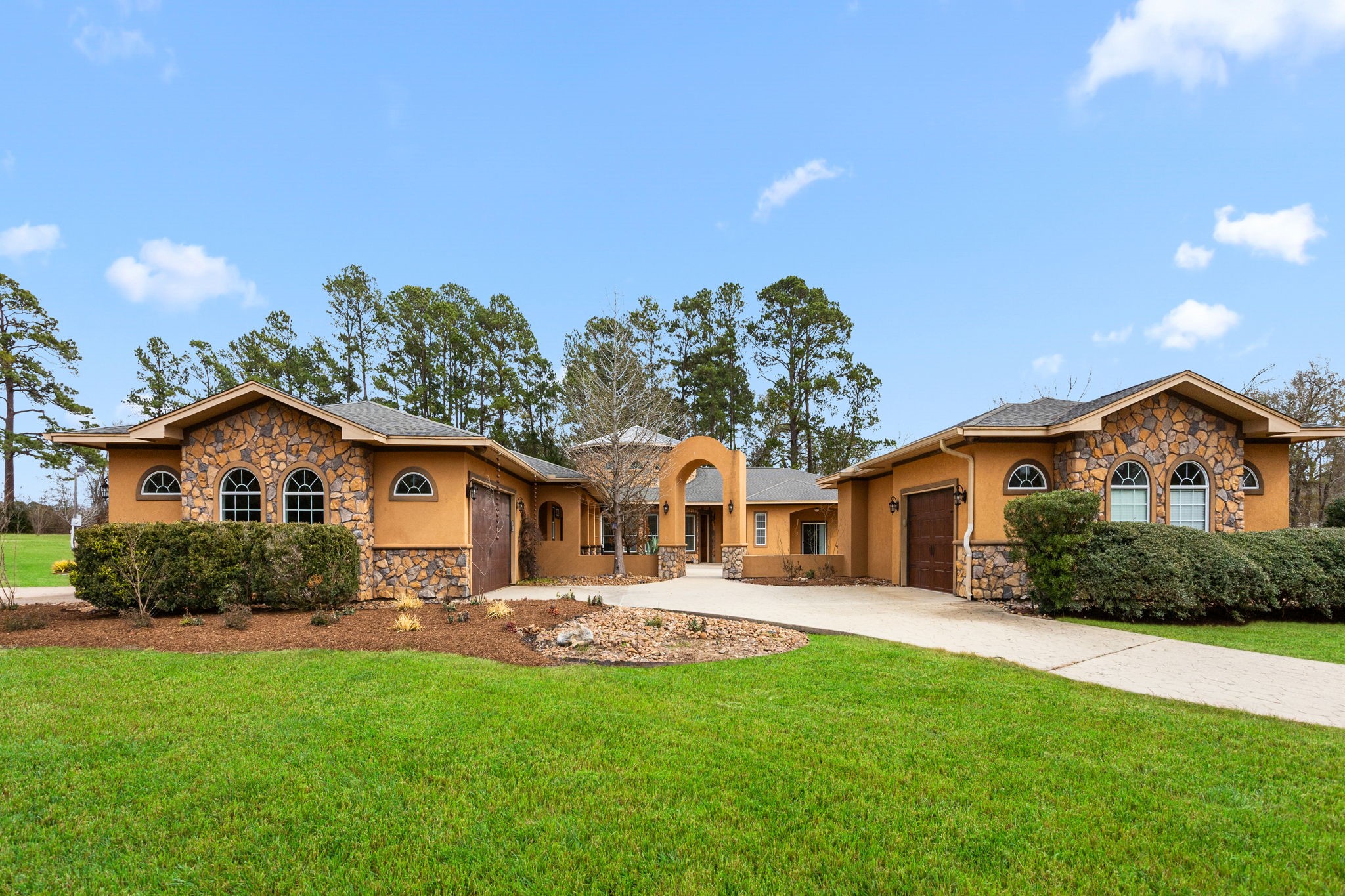 a front view of house with yard and green space