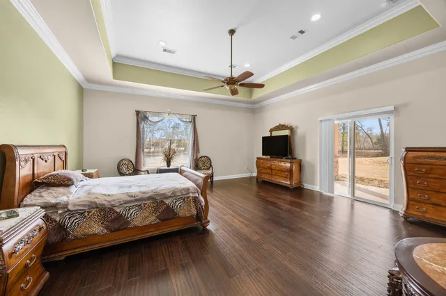 a spacious bathroom with a double vanity sink a mirror and a bathtub