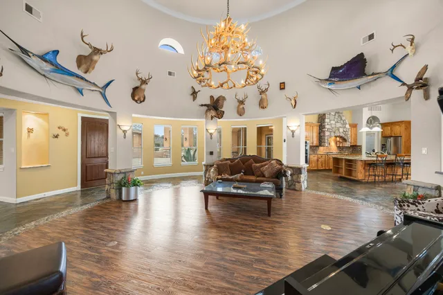 a living room with furniture or wooden floor and a chandelier