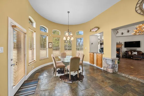a view of a dining room with furniture window and outside view