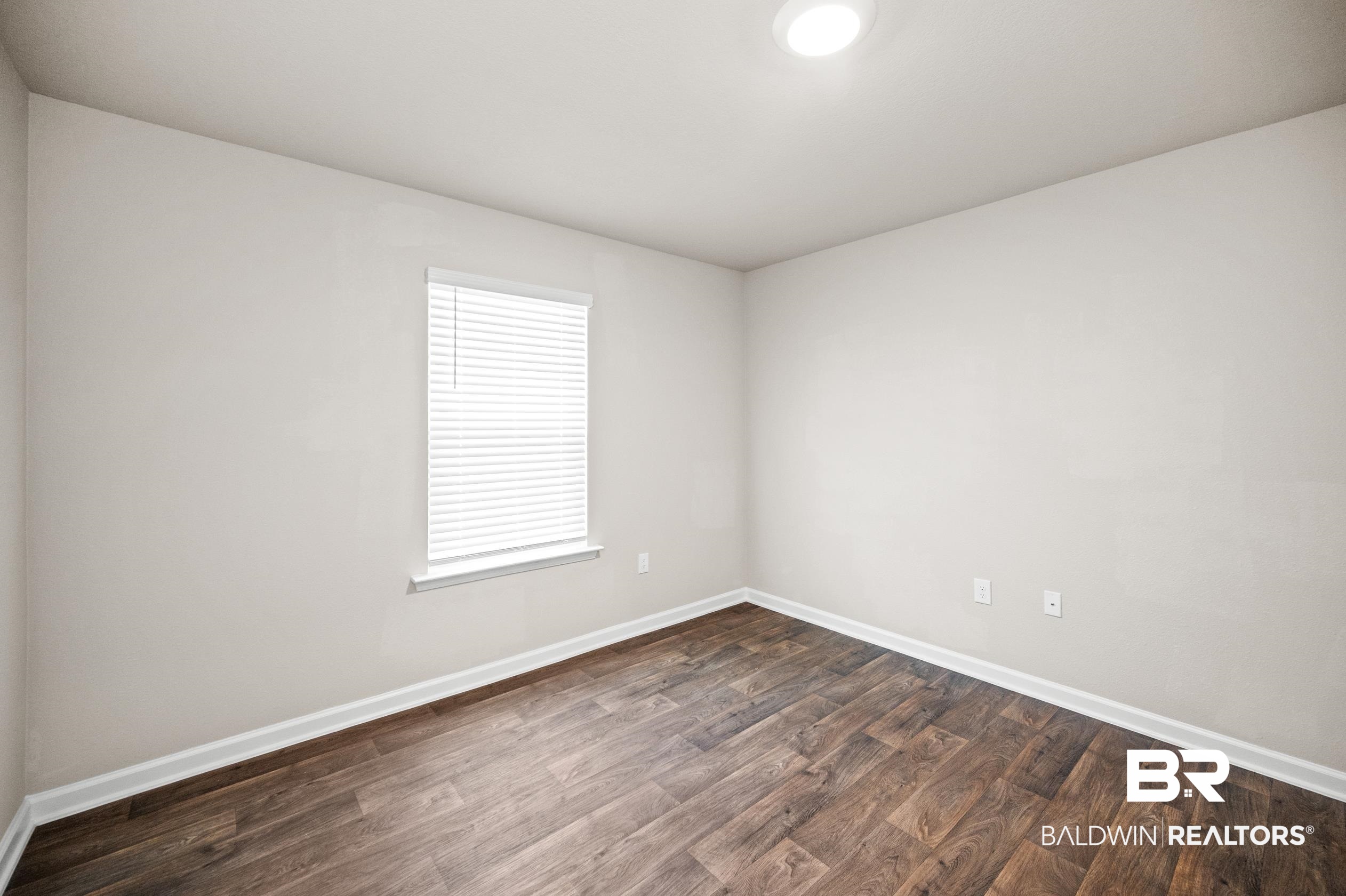 10353 Zenyatta Loop Daphne, AL 36526 - Photo 27 of 33 Spare room with hardwood / wood-style flooring