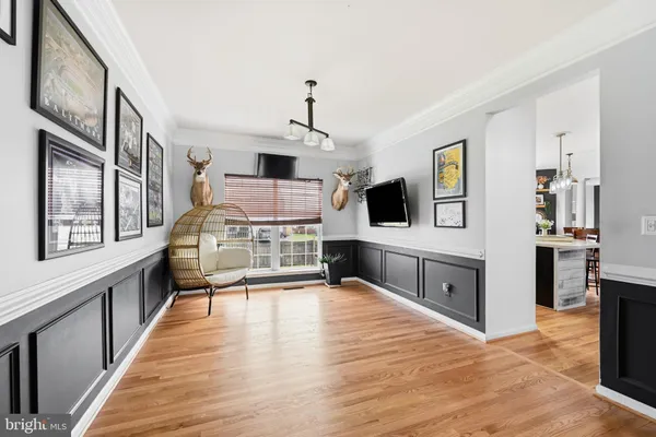 a view of a living room kitchen and a sink