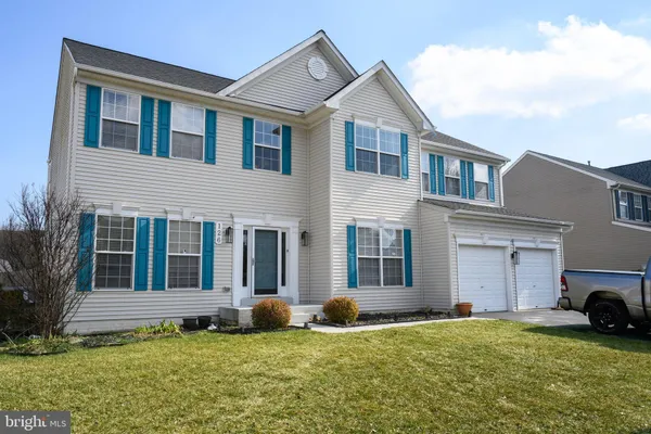a big house with a big yard and more windows