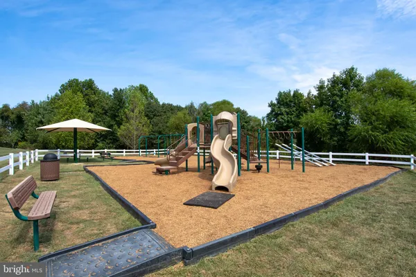 swimming pool view with a seating space