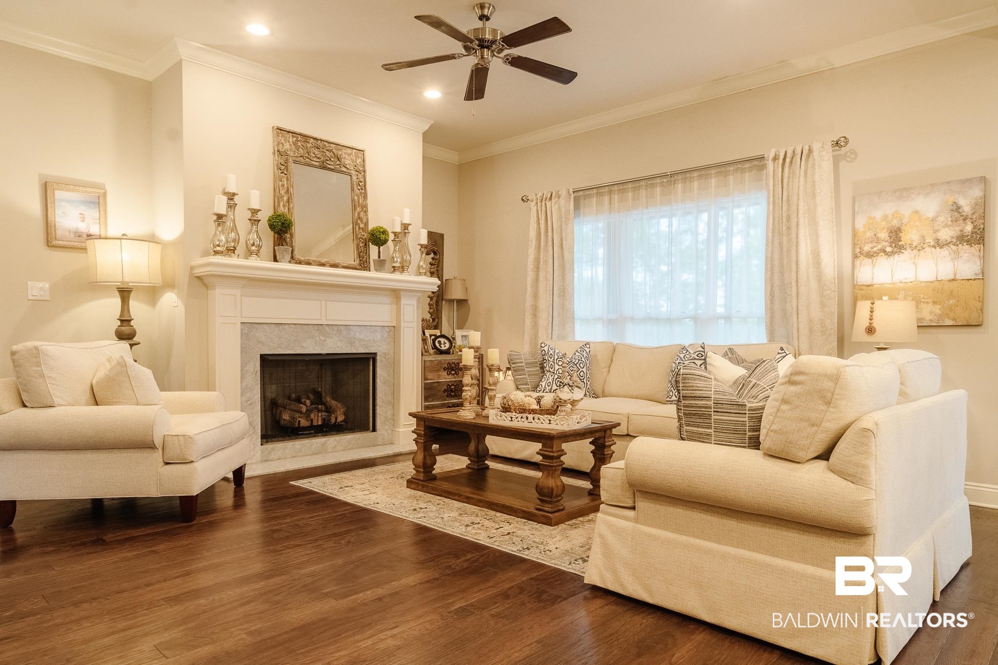 7235 Raleigh Way Mobile, AL 36695 - Photo 12 of 52 Living area with a fireplace, dark wood-style floors, crown molding, and a ceiling fan